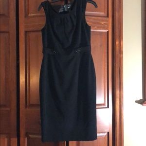 Cute sheath dress w/button detail.